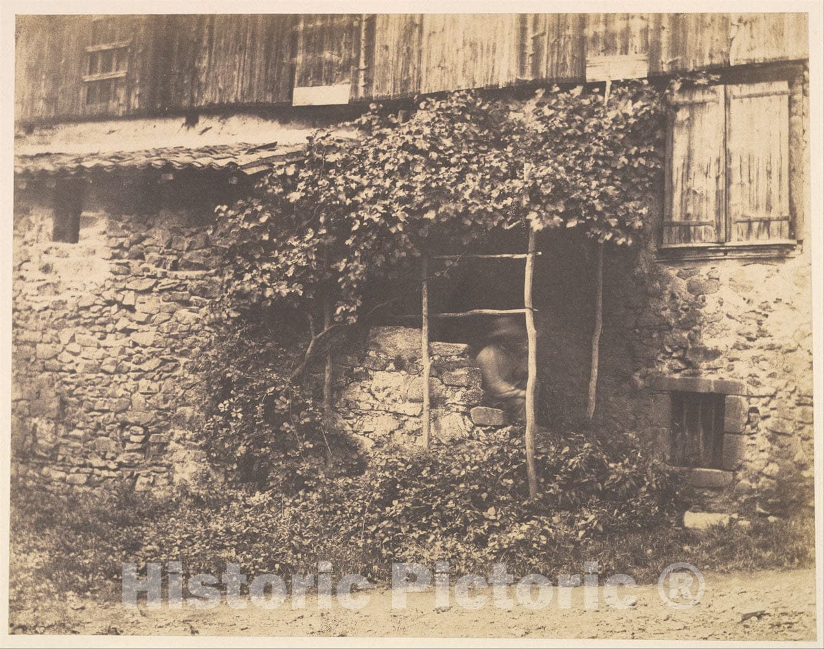 Photo Print : André Giroux - Rustic Building with Man Under Trellis : Vintage Wall Art