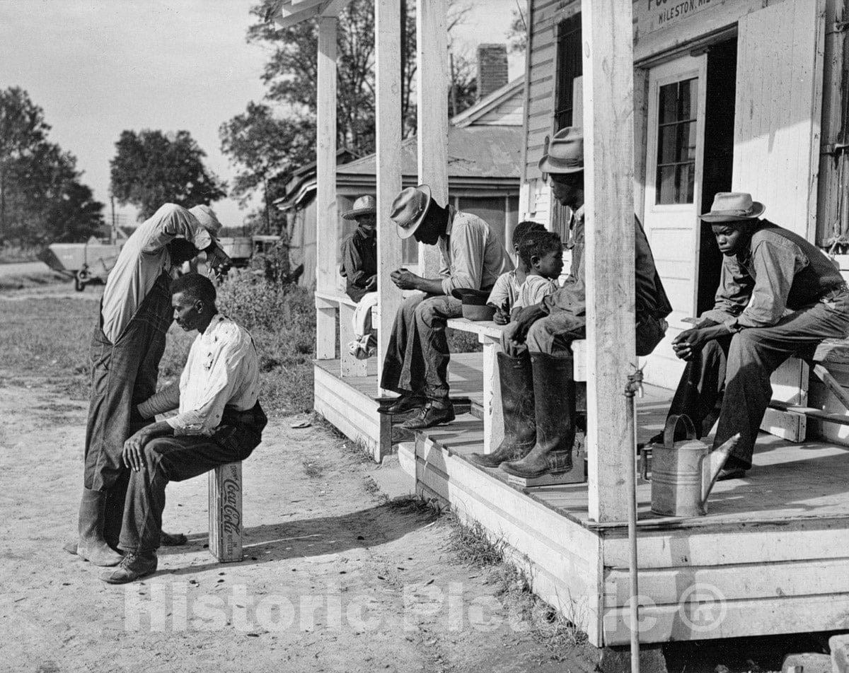 Photo Print : Marion Post Wolcott - Open-Air Barber at Work and Waiting Customers Before Mileston, Mississippi, Post Office : Vintage Wall Art