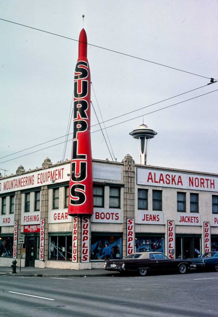 Historic Photo : 1977 Surplus Store, vertical, 1st Avenue & Battery Street, Seattle, Washington | Margolies | Roadside America Collection | Vintage Wall Art :