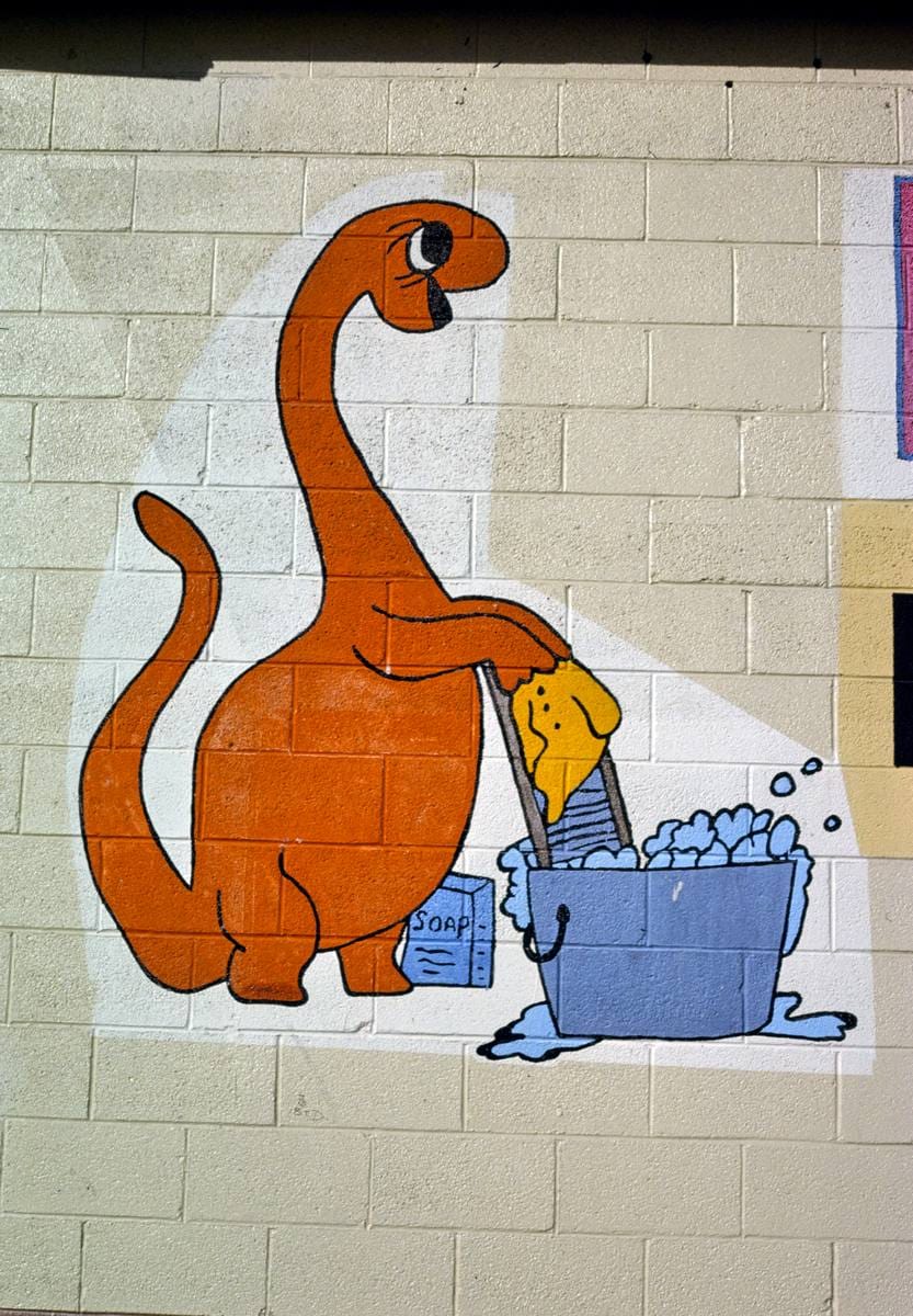 Historic Photo : 1991 Holiday Laundromat facade sign, dinosaur detail, Route 40, Vernal, Utah | Margolies | Roadside America Collection | Vintage Wall Art :
