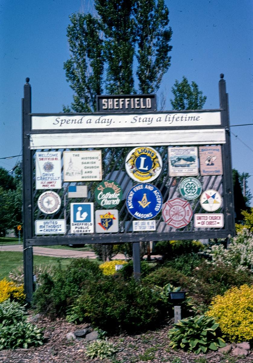 Historic Photo : 2003 Sheffield welcome sign, Routes 6 & 34 (angle 1), Sheffield, Illinois | Margolies | Roadside America Collection | Vintage Wall Art :