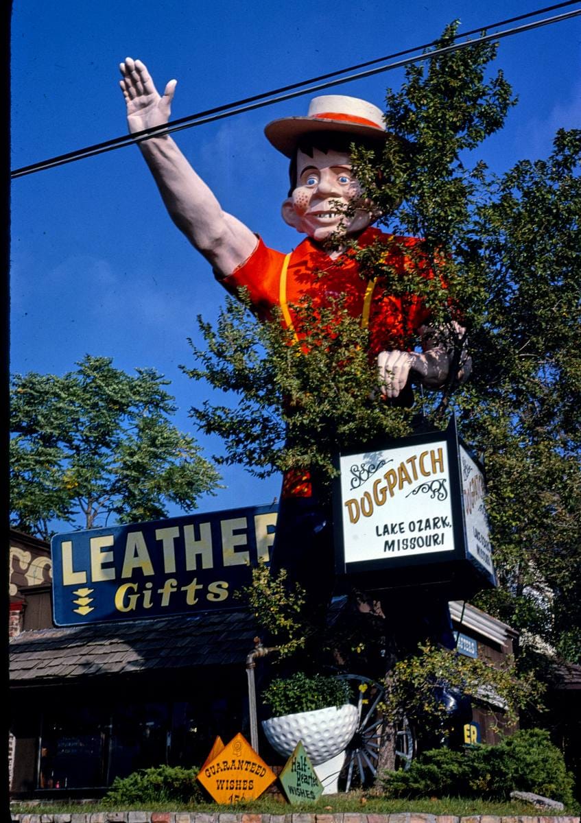 Historic Photo : 1980 Dog Patch entrance statue, Route 54B, Lake Ozark, Missouri | Margolies | Roadside America Collection | Vintage Wall Art :