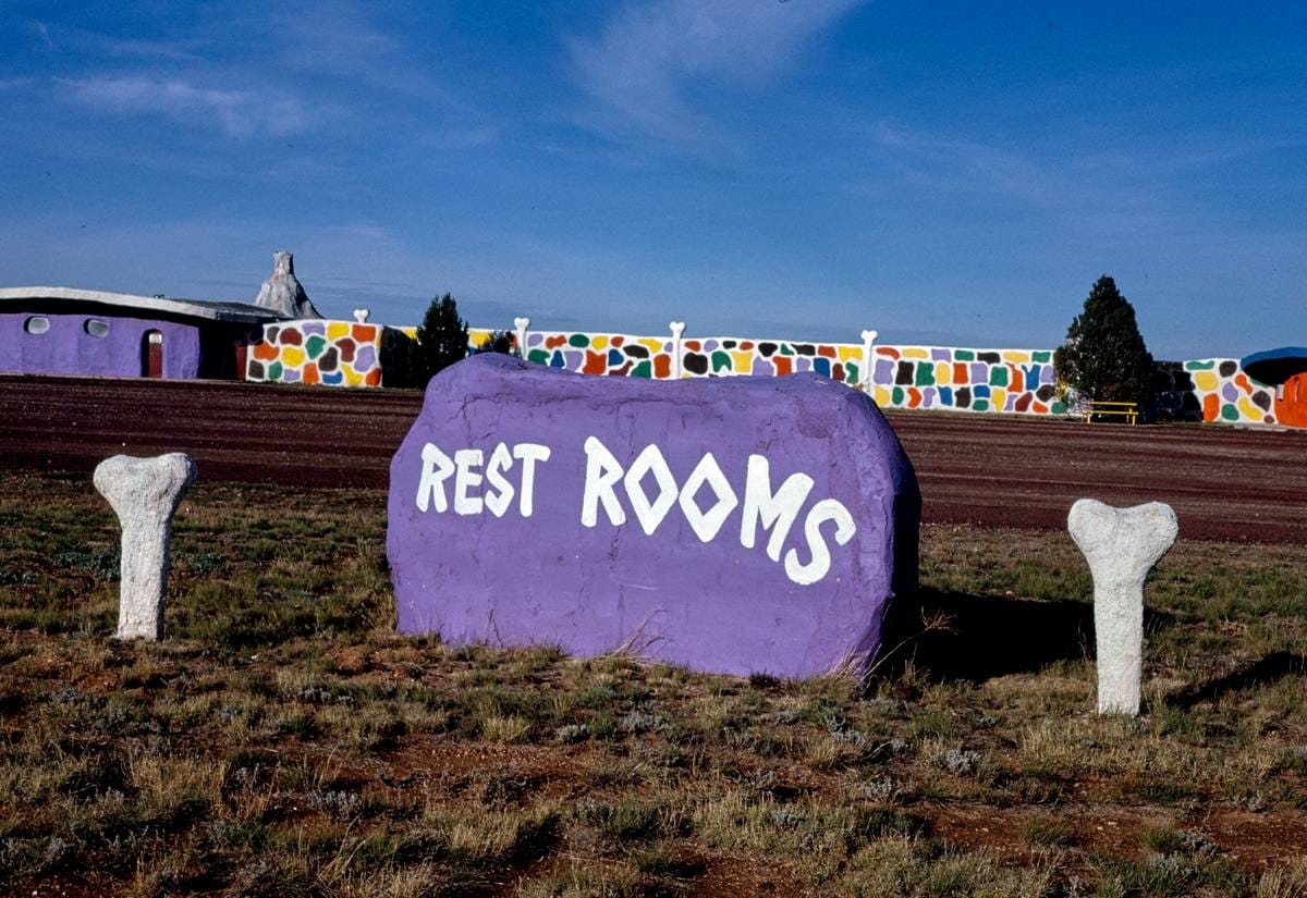 Historic Photo : 1987 Rest room signs, Flintstone's Bedrock City, Valle, Arizona | Margolies | Roadside America Collection | Vintage Wall Art :