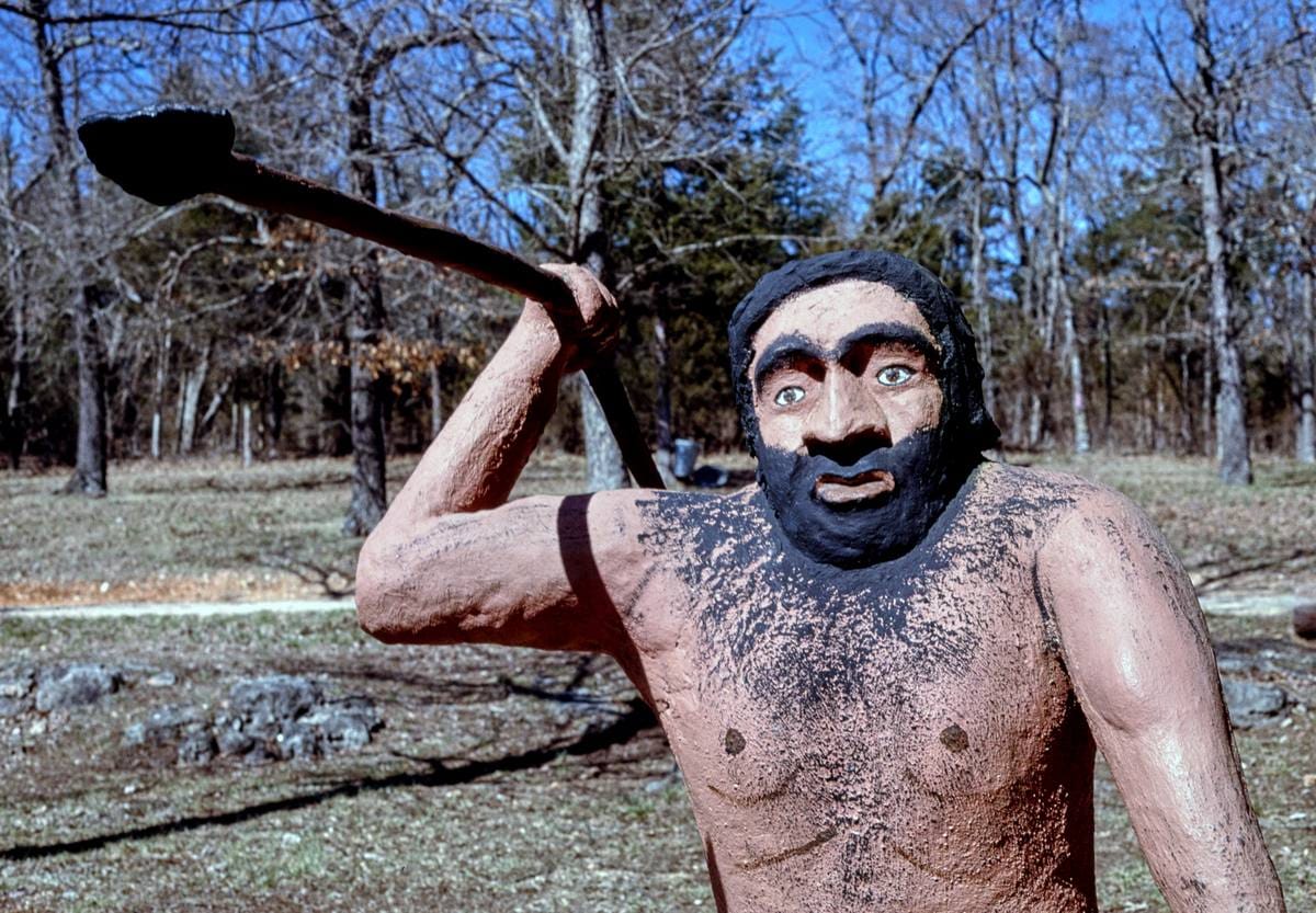 Historic Photo : 1994 Caveman with spear, Dinosaur World, Eureka Springs, Arkansas | Margolies | Roadside America Collection | Vintage Wall Art :