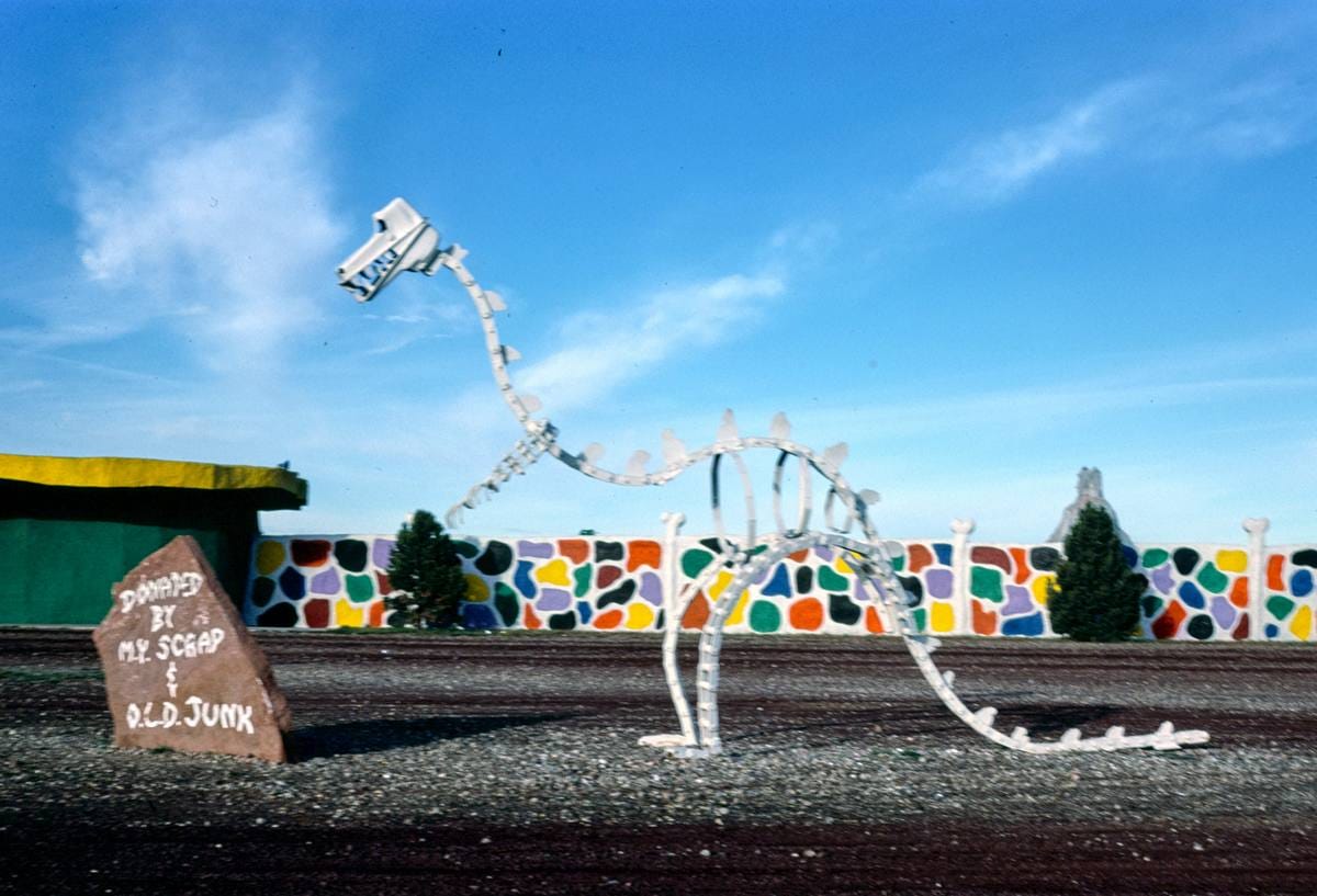Historic Photo : 1987 Dino skeleton view 2, Flintstone's Bedrock City, Rts. 64 and 180, Valle, Arizona | Margolies | Roadside America Collection | Vintage Wall Art :