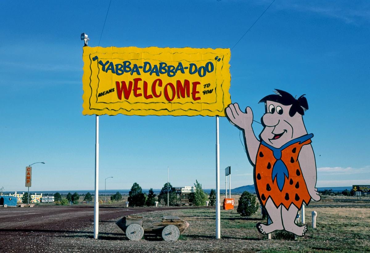 Historic Photo : 1987 Welcome sign, Flintstone's Bedrock City, Rts. 64 and 180, Valle, Arizona | Margolies | Roadside America Collection | Vintage Wall Art :