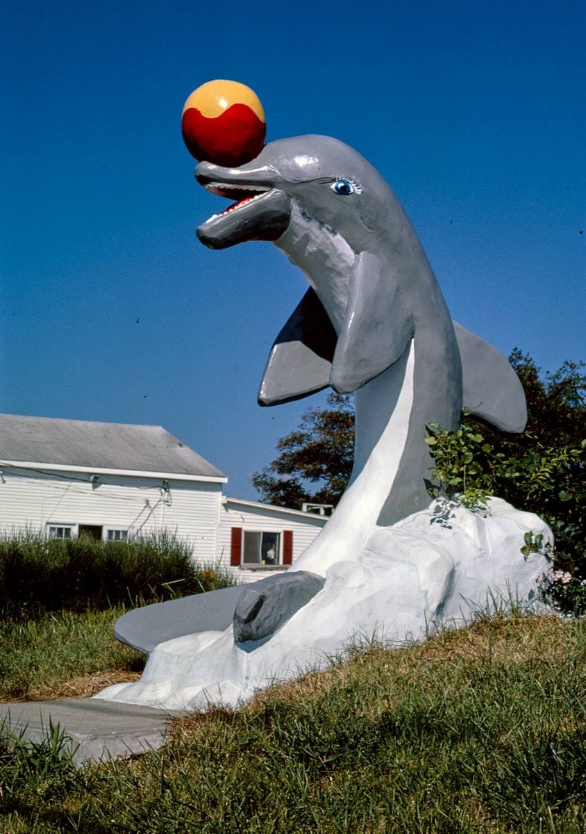 Historic Photo : 1984 Dolphin statue, Aqua Circus, Route 28, Yarmouth, Massachusetts | Margolies | Roadside America Collection | Vintage Wall Art :