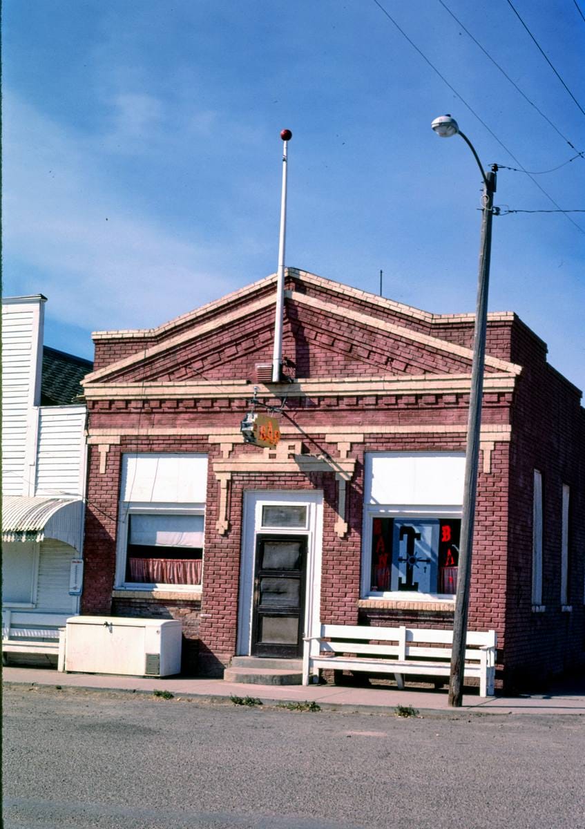 Historic Photo : 1987 Bar-Farmer's State Bank (1912), Reed Street, Rudyard, Montana | Margolies | Roadside America Collection | Vintage Wall Art :