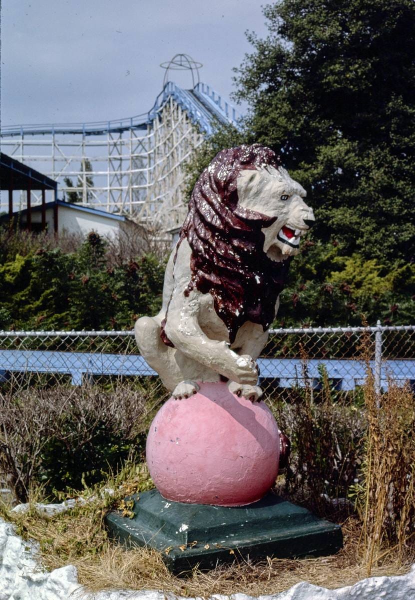 Historic Photo : 1985 Buchroe Beach Amusement Park lion on ball statue, Hampton, Virginia | Margolies | Roadside America Collection | Vintage Wall Art :