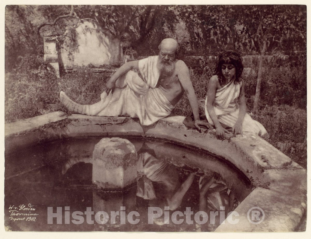 Photo Print : Wilhelm von Gloeden - Elderly Man and Young Boy at Garden Fountain, Sicily, Italy : Vintage Wall Art