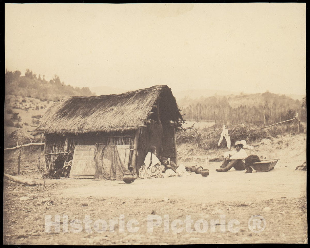 Photo Print : Family Seated by Thatched Hut, South America : Vintage Wall Art