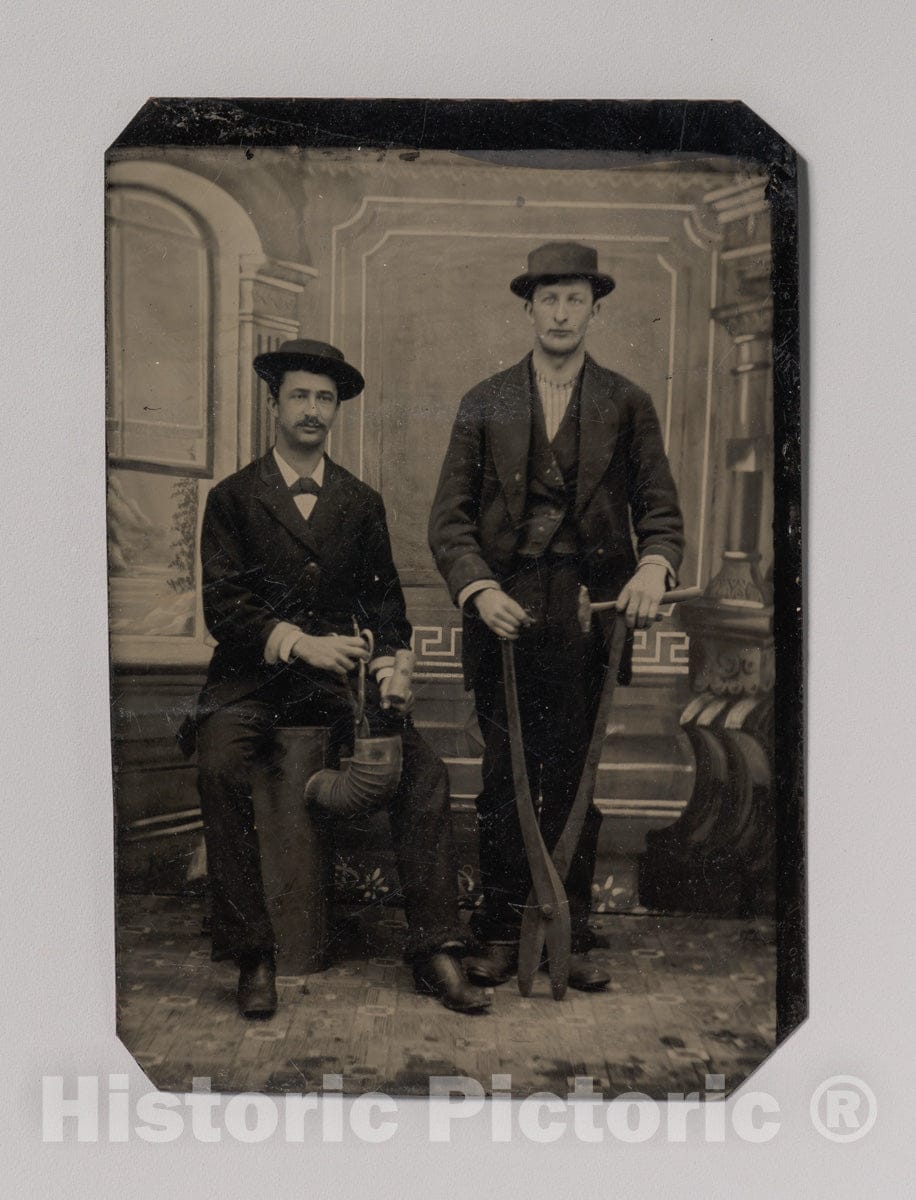 Art Print : Two Stovepipe Makers, One with a Hammer and Tin Snips, The Other Sitting on Stovepipe Assembly with Tin Snips and Mallet - Artist Unknown : Vintage Wall Art