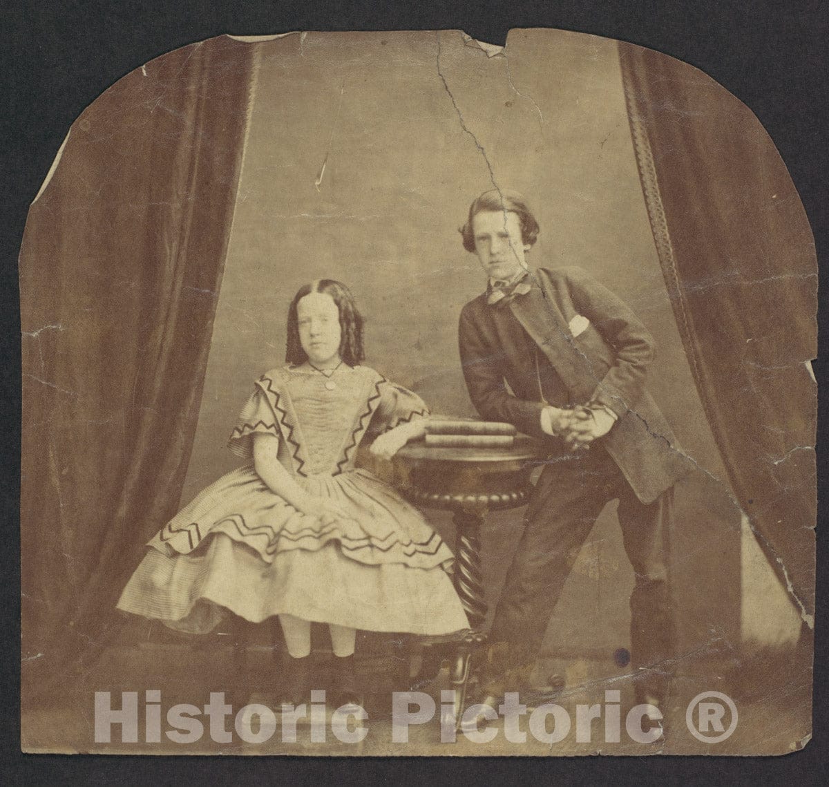 Photo Print : Young Girl, Seated, with Young Boy, Leaning on Table : Vintage Wall Art