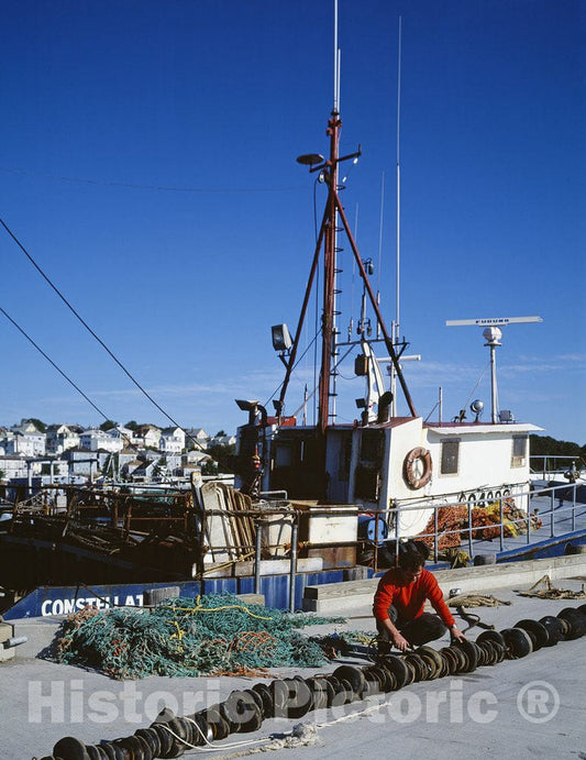 Gloucester, MA Photo - Fisherman Repairs his net in Gloucester, Massachusetts