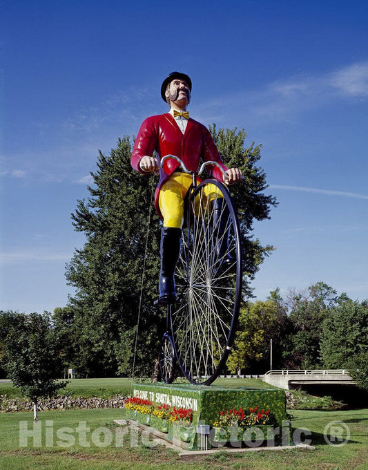 Sparta, WI Photo - The World's Largest Bike, a 30-Foot Fiberglass Model with Rider, erected in 1997 on The nation's First Rails-to-Trails Path
