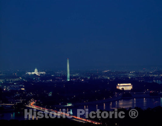 Photo- Nightime Aerial View of Washington with The Francis Scott Key Bridge Over The Potomac River in The Foreground, The Lincoln Memorial, Washington Monument, and U.S