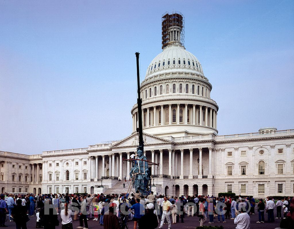 Photo - A Crowd Gathers to Watch The Statue of Freedom, which Normally Stands ATOP The U.S. Capitol Dome, and was Lowered for Restoration Work in 1993. Washington, D.C.