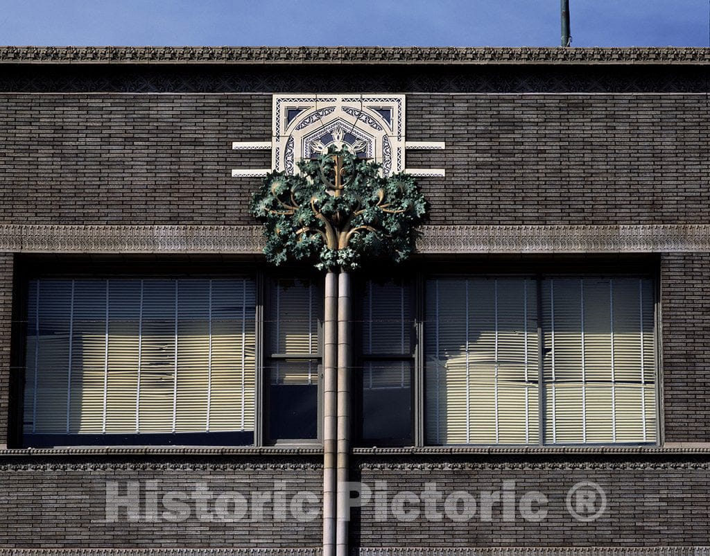 Clinton, IA Photo - Detail of The Van Allen Office Building, showcasing its Distinctive VA Trademark Against a Floral Background. Clinton, Iowa