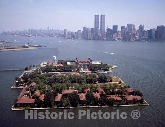 Jersey City, NJ Photo - Aerial View of The Ellis Island Immigration Station, with The World Trade Center Twin Towers, New York City, in The Distance