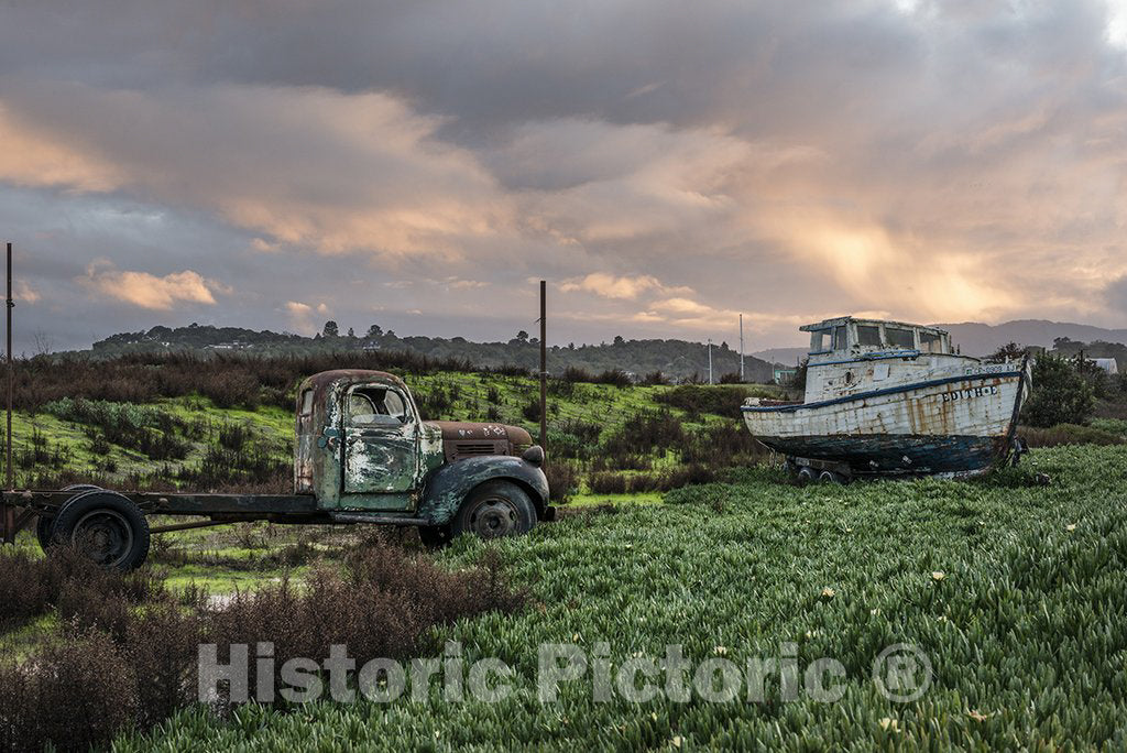 Petaluma, CA Photo - An old truck and a well-used boat (out of water) at the entryway to the Port Sonoma Marina in Petaluma, California