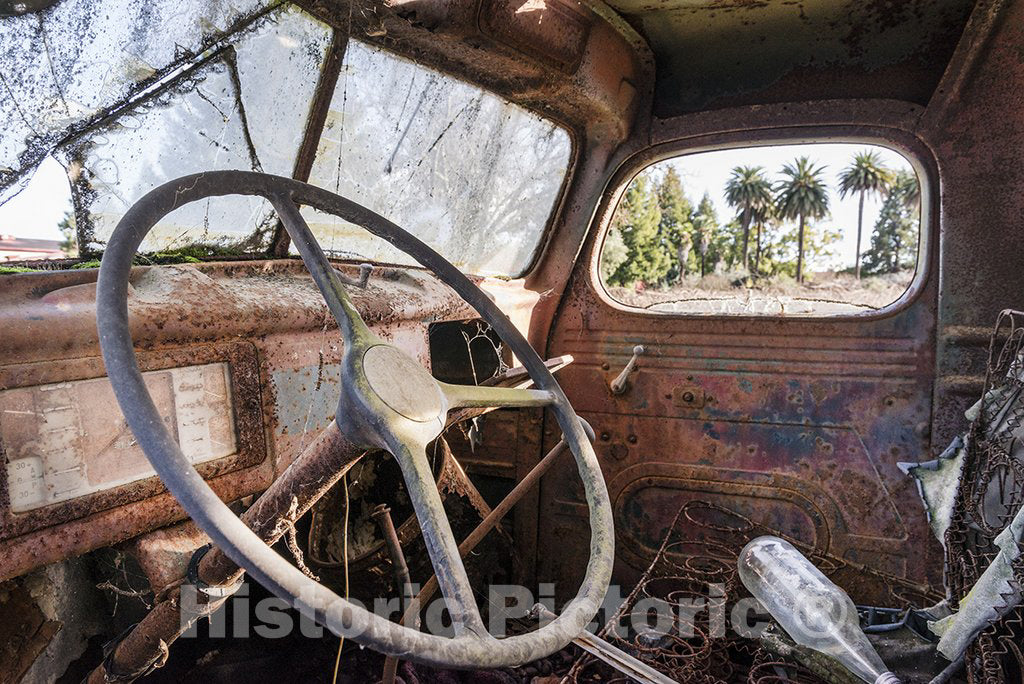 Napa Valley, CA Photo - The rusted-out cabin of an old truck used for irrigation drilling, parked amid the vineyards of Napa Valley, California