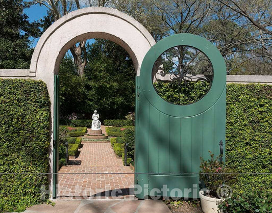 Photograph- View through a gateway at the"Clio Garden" and the figure of the muse, Clio, at Bayou Bend, the longtime estate of Houston philanthropist and collector Ima Hogg in the River Oaks