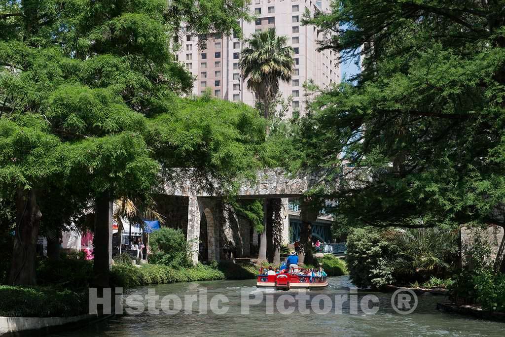 Photo - Visitors to San Antonio take a Barge Ride Along The River Walk, a Portion of The San Antonio River That Winds Beneath The Streets of The City- Fine Art Photo Reporduction