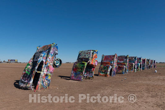 Photo- Robert Griffin is no spray-painting vandal. Like thousands of other visitors to the"Cadillac Ranch" along Old U.S 2 Fine Art Photo Reproduction