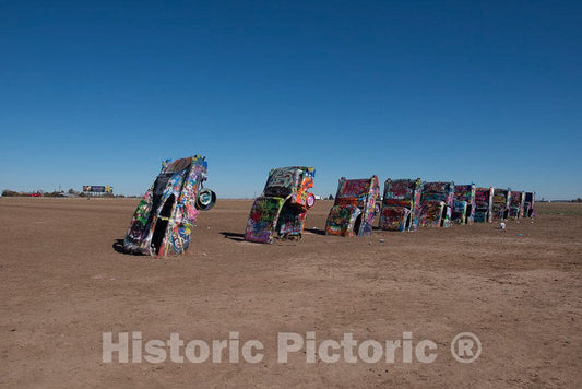 Photo- Robert Griffin is no Spray-Painting Vandal. Like Thousands of Other Visitors to The Cadillac Ranch Along Old U.S 3 Fine Art Photo Reproduction