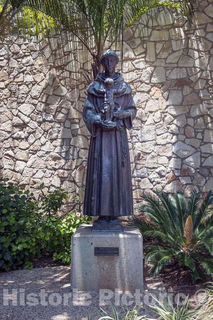 Photograph- Statue of Anthony of Padua, Saint Anthony, holding the Child Jesus, located along the subterranean public walk known as River Walk bordering the San Antonio River in San Antonio