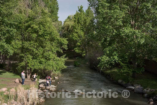 Photograph- A Family Experiences a Surprisingly Remote-Looking Stretch of The Historic Arkansas Riverwalk, a 32-Acre Urban Waterfront with Excursion and Gondola Boat Rides, Food, Festivals