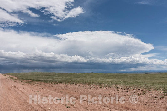 Photo - Storm Clouds Gather Over a Long Dirt Road in Albany County, Wyoming- Fine Art Photo Reporduction