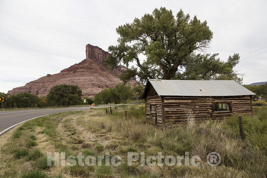 Gateway, CO Photo - Cabin below The Palisade, a towering red-rock buttress near the town of Gateway in Mesa County, Colorado.