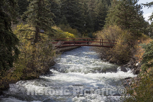 Bailey, CO Photo - A rushing mountain stream and footbridge in Bailey, Colorado.