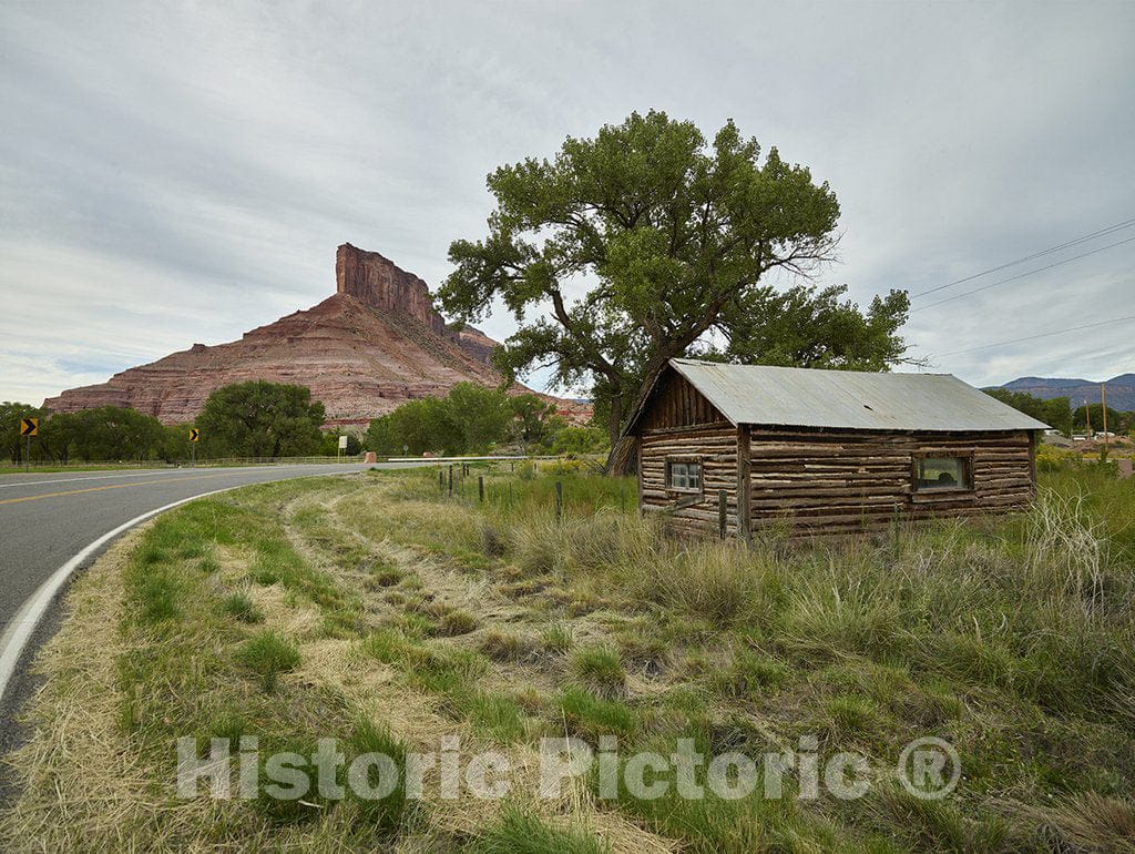 Gateway, CO Photo - Cabin below The Palisade, a towering red-rock buttress near the town of Gateway in Mesa County, Colorado.