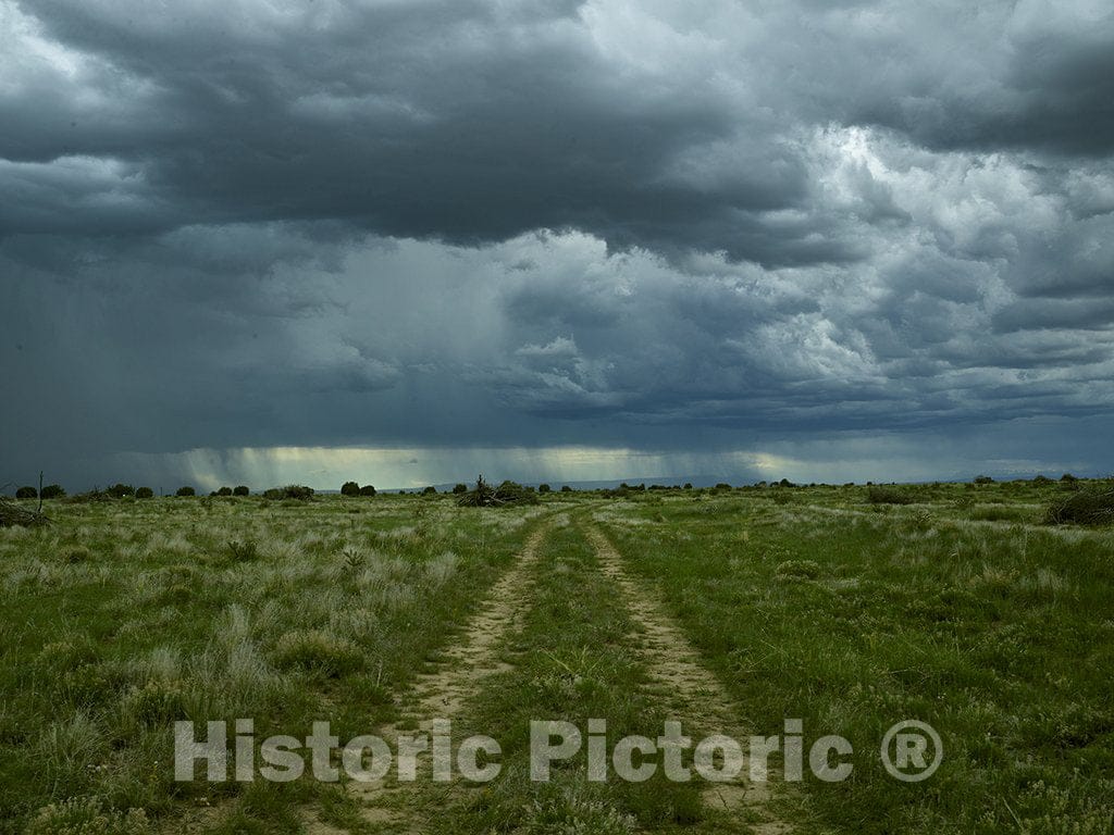 Las Animas County, CO Photo - A Storm Brews Above a Dirt Road at JE Canyon Ranch, a Former Working Cattle Ranch. -