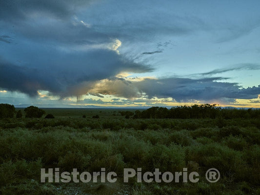Alamosa County, CO Photo - Sunset Over The Mountains Near The Great Sand Dunes National Park and Preserve in Alamosa County, Colorado.