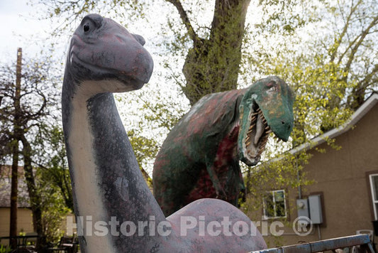 Photo- Plaster dinosaurs run amok outside the Antares Fossils & Minerals store in Evanston; a Uinta County city in the very southwest corner of Wyoming 2 Fine Art Photo Reproduction