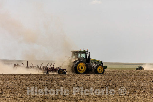 Bristol, CO Photo - A Farmer Kicks up dust as he readies The Ground for Planting Near Bristol in Prowers County, Colorado.