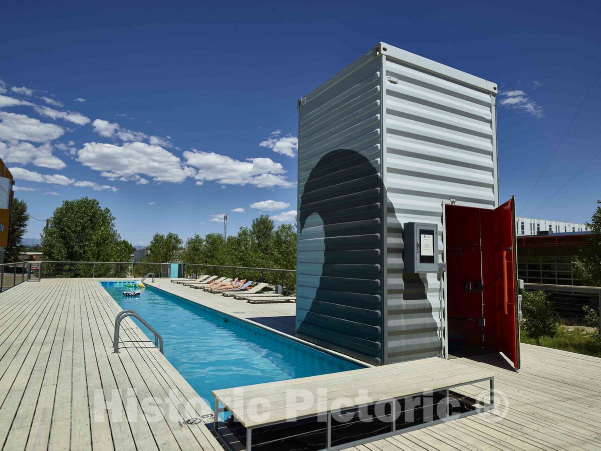 Photo- A Swimming Pool and Supply Building Made of Huge Shipping containers, The Kind Piled high on seagoing Vessels, in The Taxi District of The RiNo, or River North