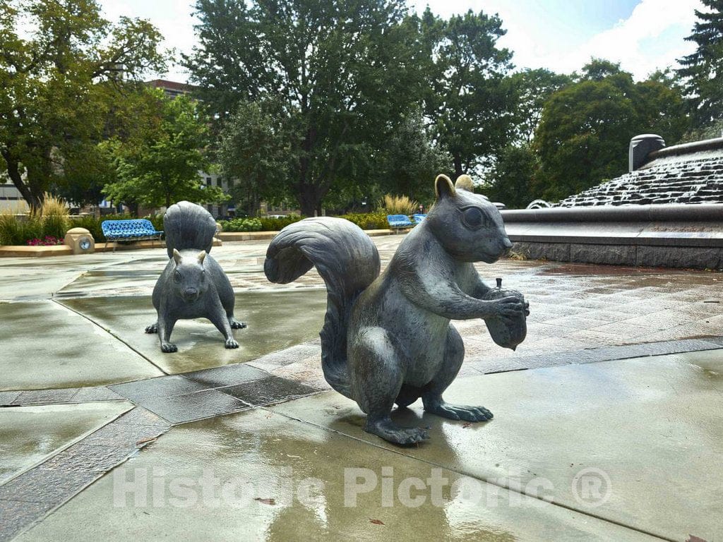 Photo- Two of six"touchable art" black squirrel statues created by Brower Hatcher in Bayliss Park in Council Bluffs, Iowa, a city that calls itself a place"where art lives"