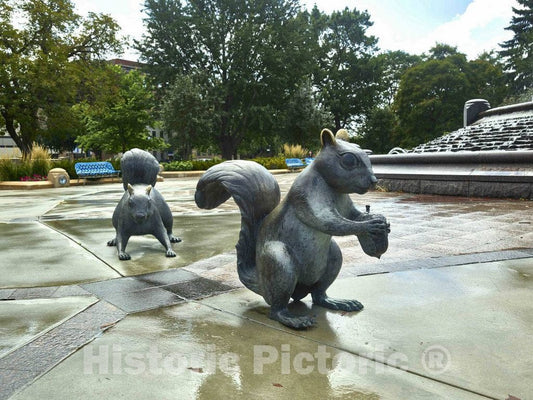 Photo- Two of six"touchable art" black squirrel statues created by Brower Hatcher in Bayliss Park in Council Bluffs, Iowa, a city that calls itself a place"where art lives"