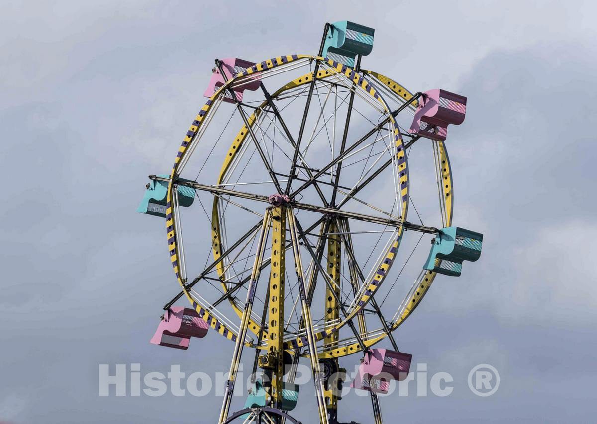 Photo - A Ferris Wheel; a Giant Vertical revolving Wheel with Passenger Cars Suspended on its Framework; at The Annual Iowa State Fair in The Capital City of Des Moines
