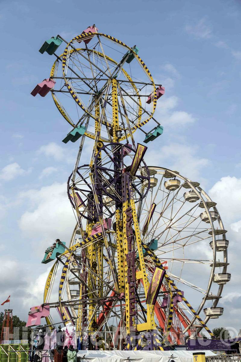 Photo - Ferris Wheels, Giant Vertical revolving Wheels with Passenger Cars Suspended on Their Framework, at The Annual Iowa State Fair in The Capital City of Des Moines