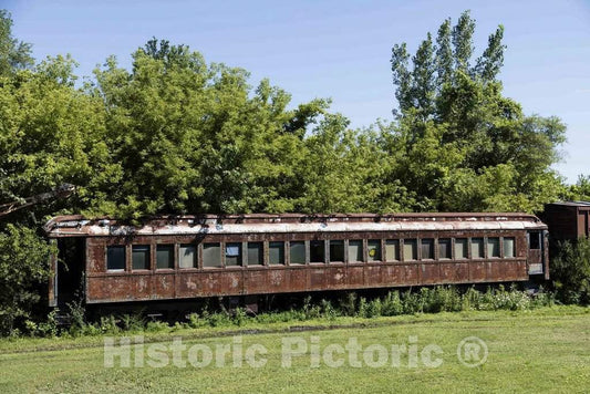 Photo - Abandoned and overgrown railroad passenger coach on the grounds of the Boone & Scenic Railroad, an excursion railway operating out of Boone, Iowa