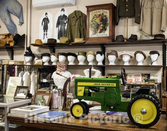 Photo- Display Inside The 1891 Burlingame's General Store, Part of The Froelich 1890 Village Museum Near McGregor, Iowa, That Includes a Tractor Display, a one-Room School