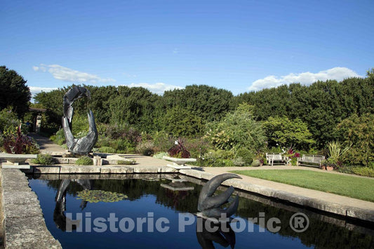 Photo- The 80-foot-long reflecting pool, designed to connect the garden thematically with nearby Lake Monona, at the Olbrich Botanical Gardens in Wisconsin's capital city of Madison