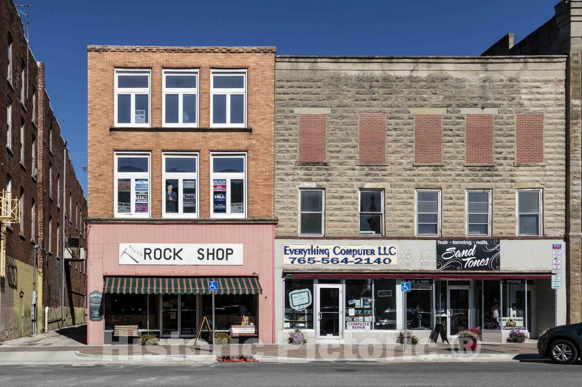 Photo- Part of a block on the Carroll County Courthouse square in Delphi, Indiana, whose places of business range from a (geological, not music)"rock shop" to a tanning, hair
