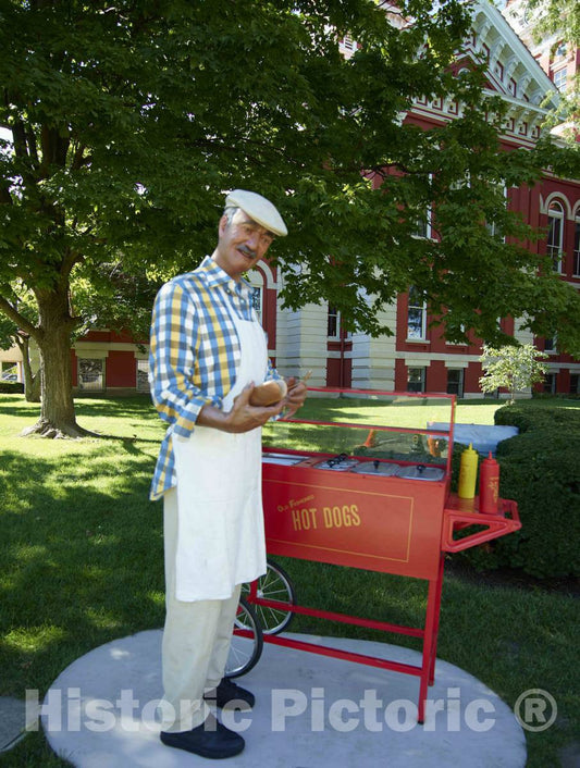 Photo- A Jovial hot-Dog Peddler, one of The 11 installations of Life-Sized Trompe L'Oeil Painted Bronze Statues Around Crown Point, Indiana, Created by John Seward Johnson II