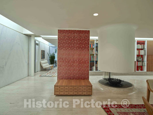 Photograph- Small art wall and bookcases near the front entrance of the Miller House, considered a modern-architecure gem designed by Finnish-American architect Eero Saarinen and completed in